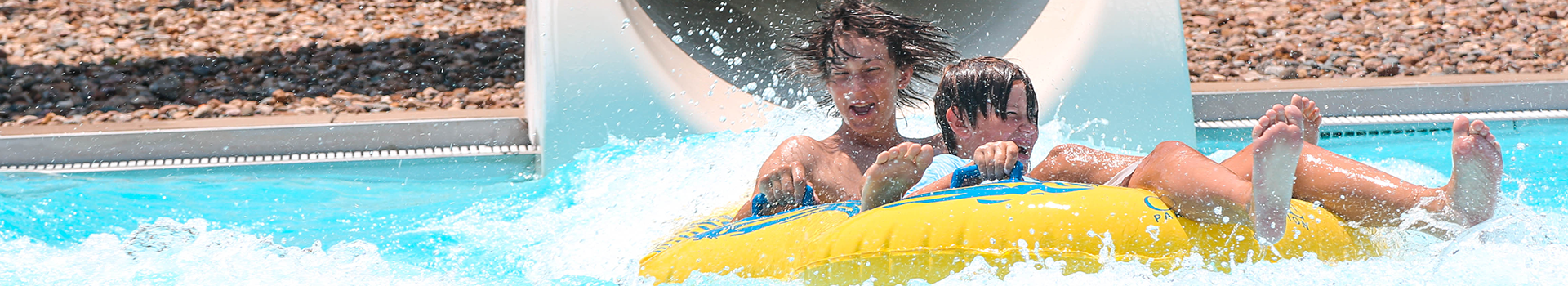 Children sliding down a waterslide