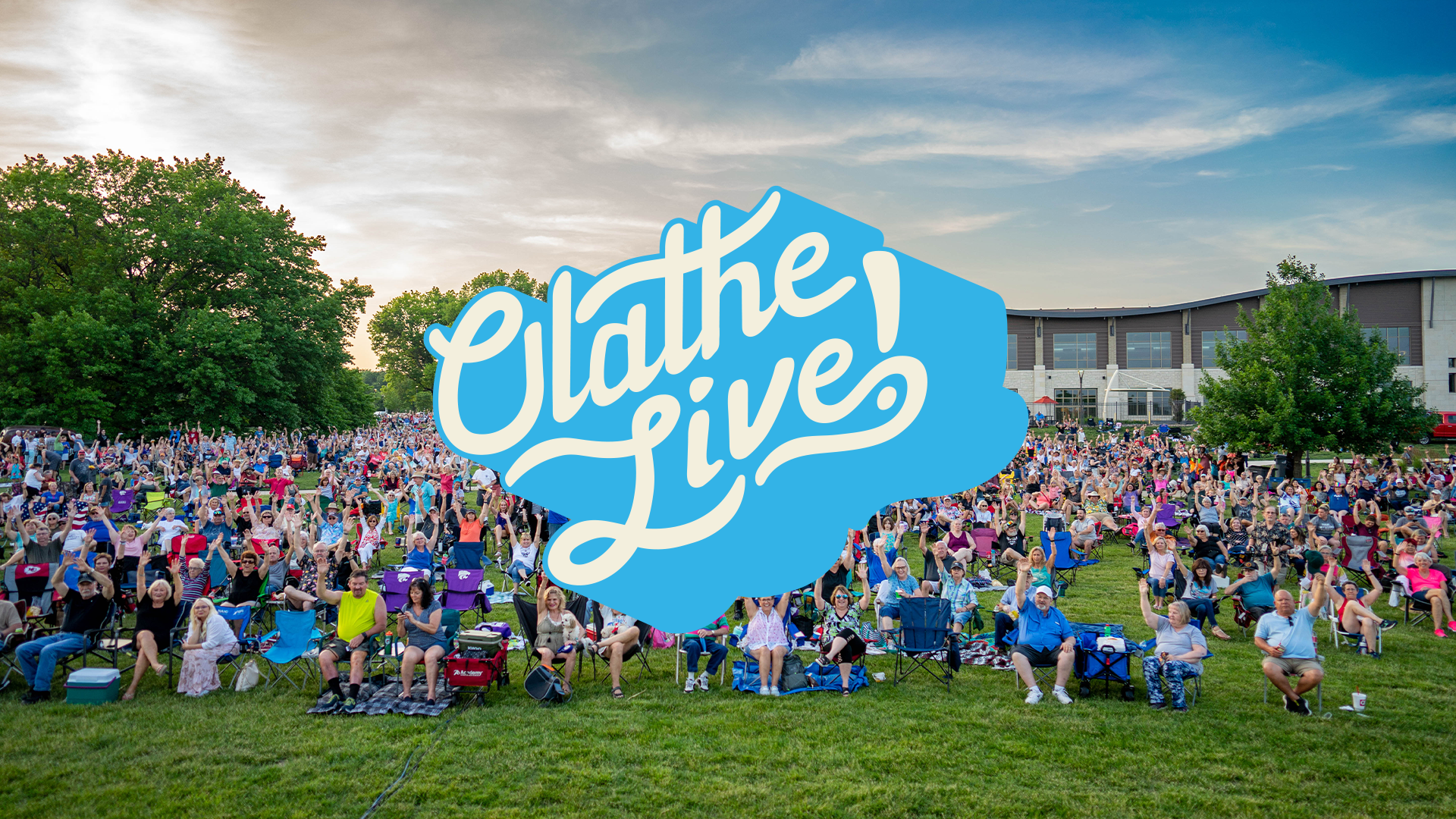 Olathe Live! logo overlayed on an image of a crowd at an outdoor concert