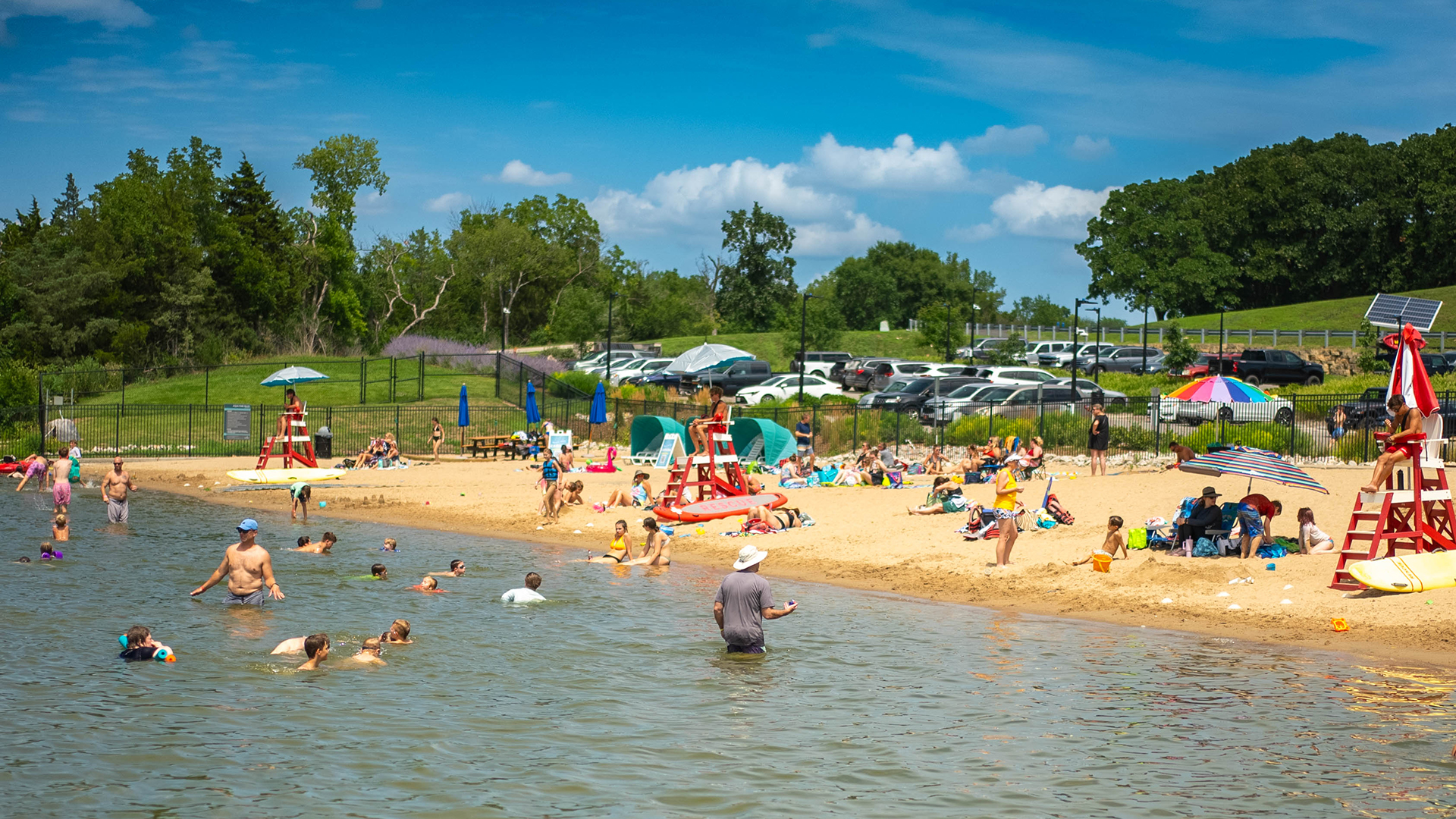 Lake Olathe Beach goers swim and play