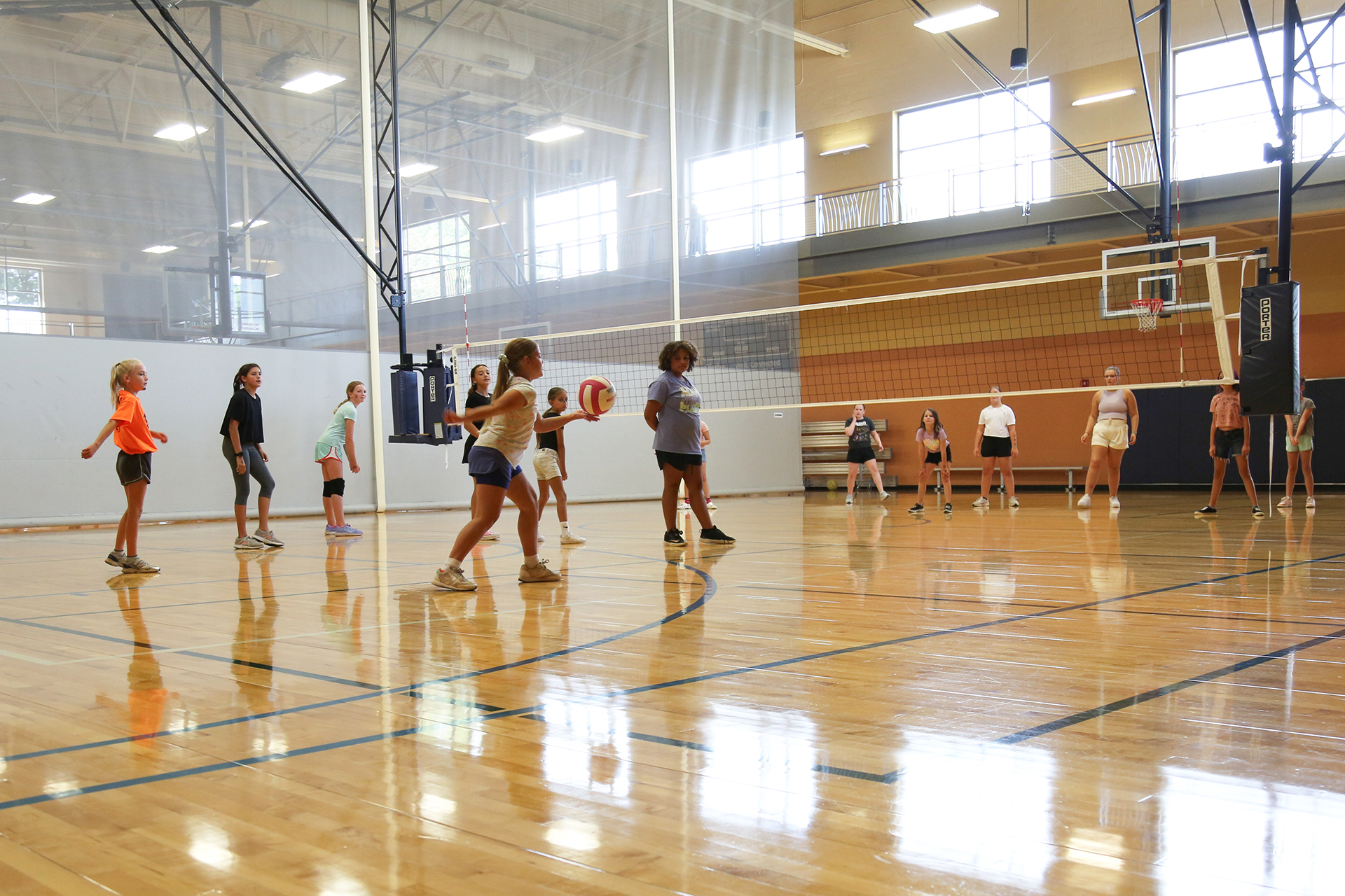 Elementary aged girls playing volleyball at the Olathe Community Center