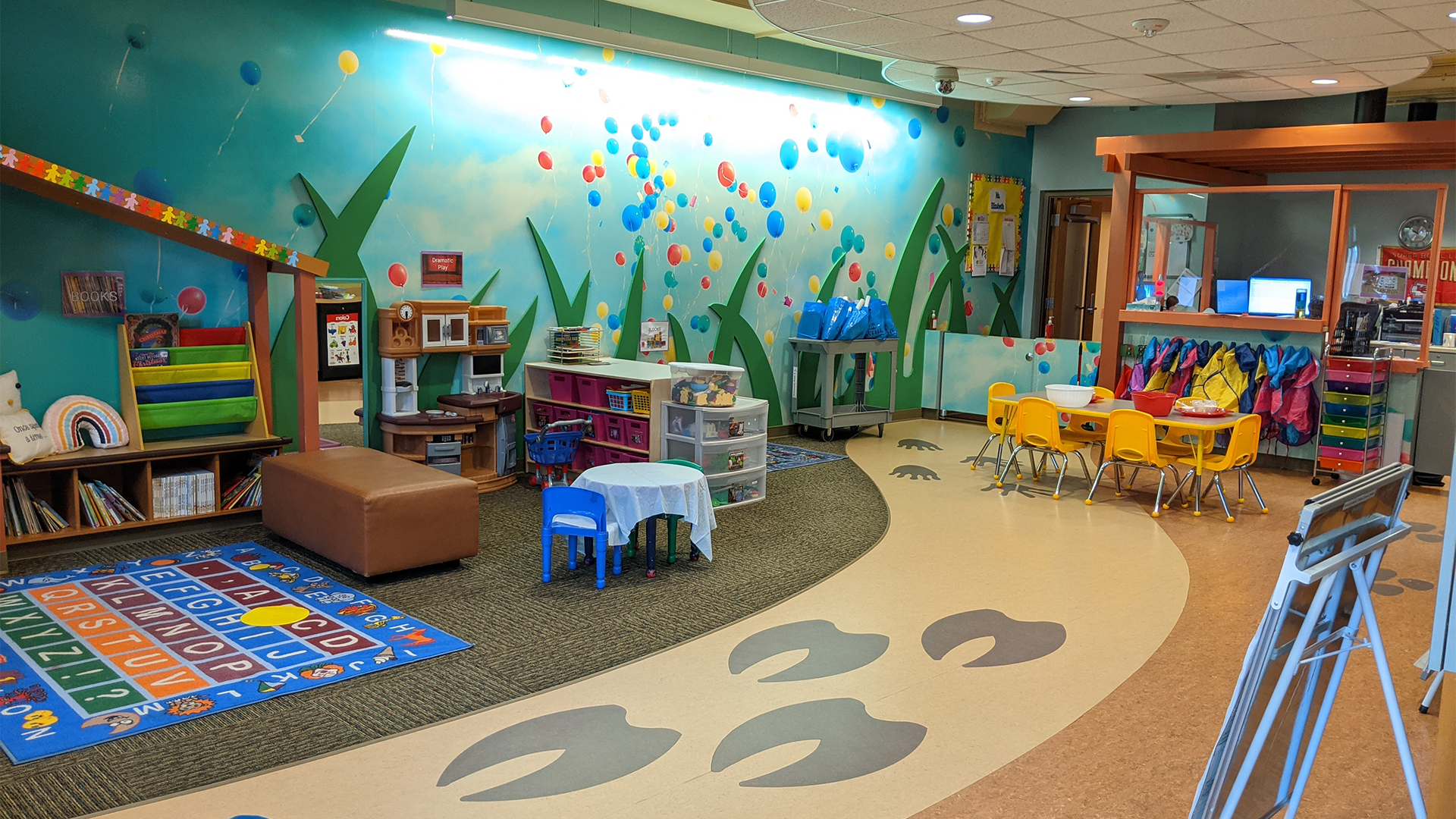 Image of a kids play room with toys and kids activities in view.