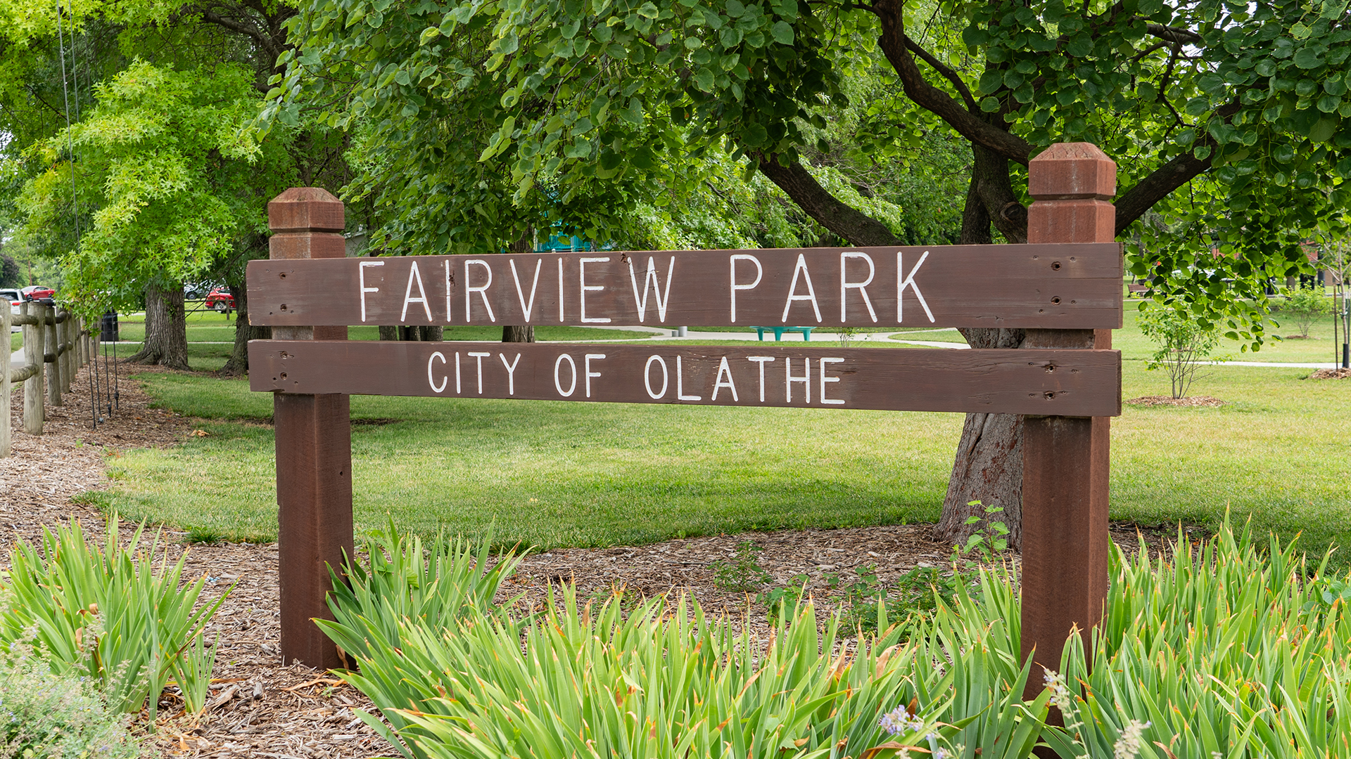 Wooden sign that states "Fairview Park" and "City of Olathe"