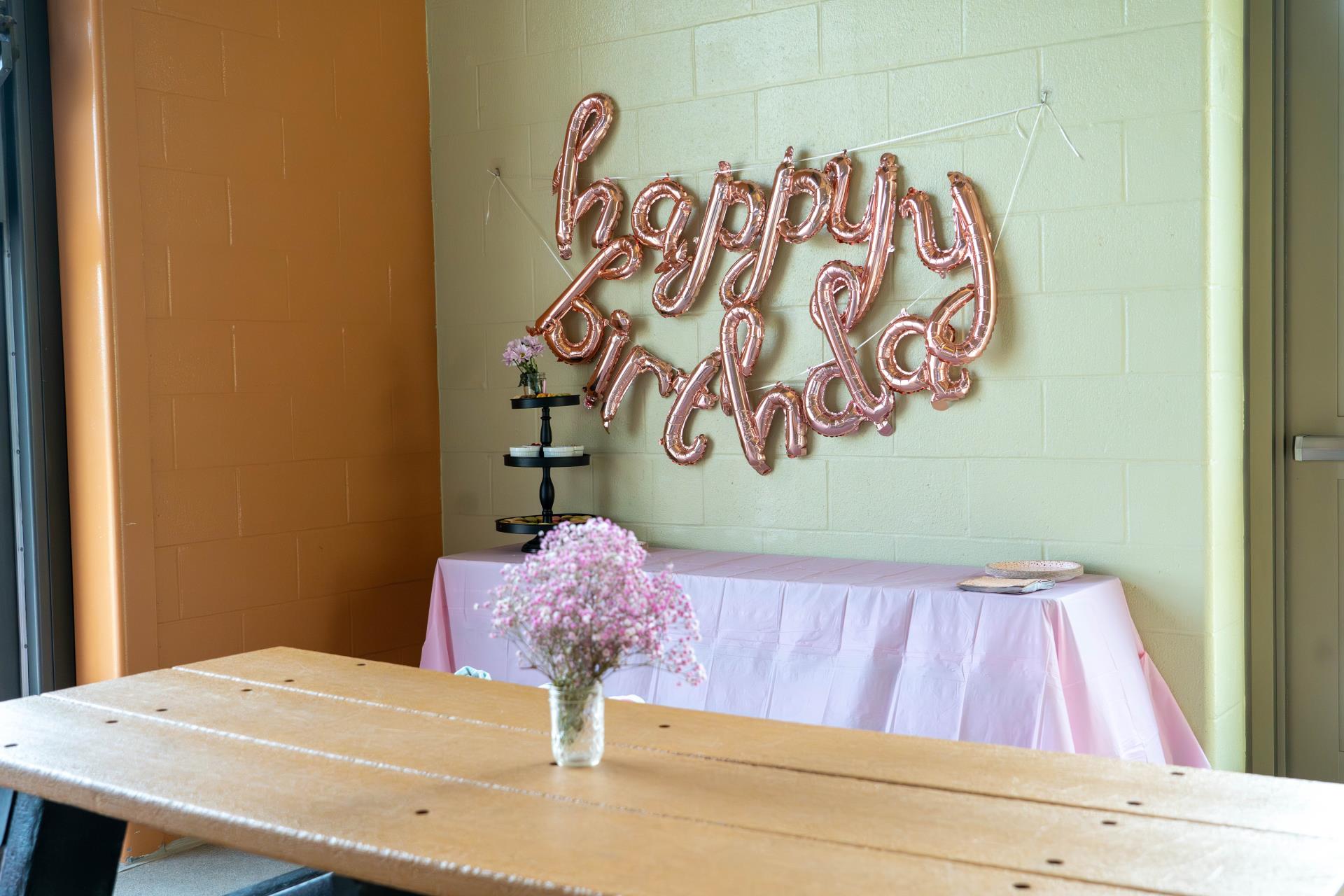 Poolside party set up with tables and balloons