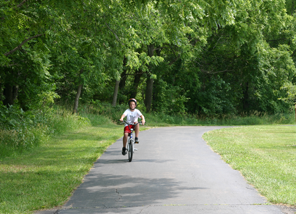 boy riding bike on trail