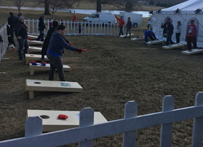 Courtyard Setting with Individuals competing in Cornhole competition